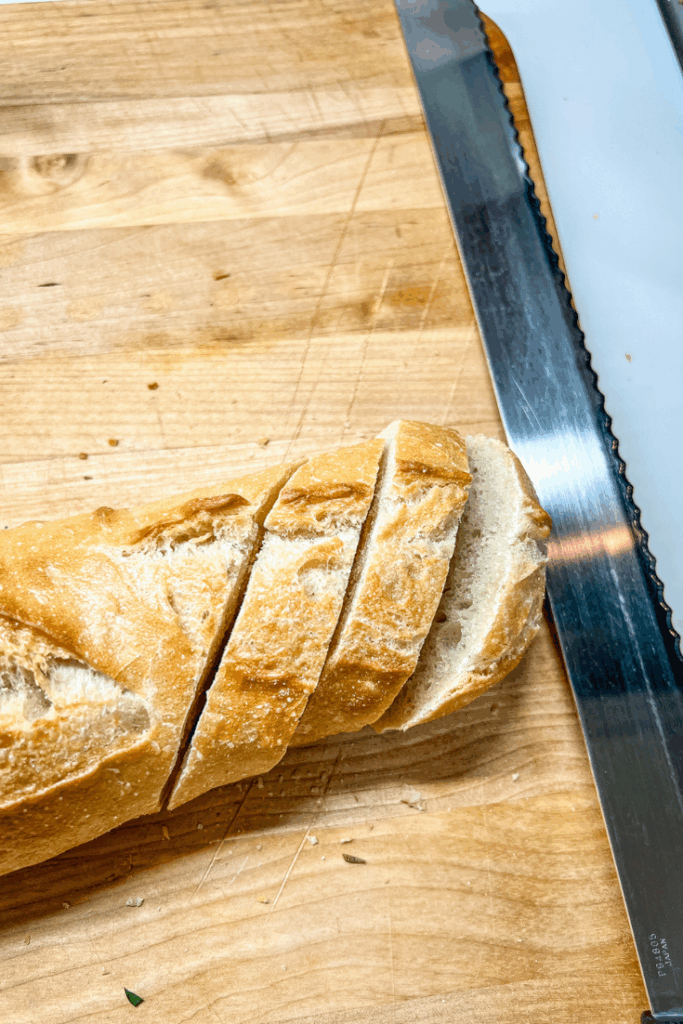sliced baguette on a cutting board