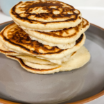 Image of what finished pancakes look like off the cast iron. A Nice dark crunchy out side with a fluffy middle.