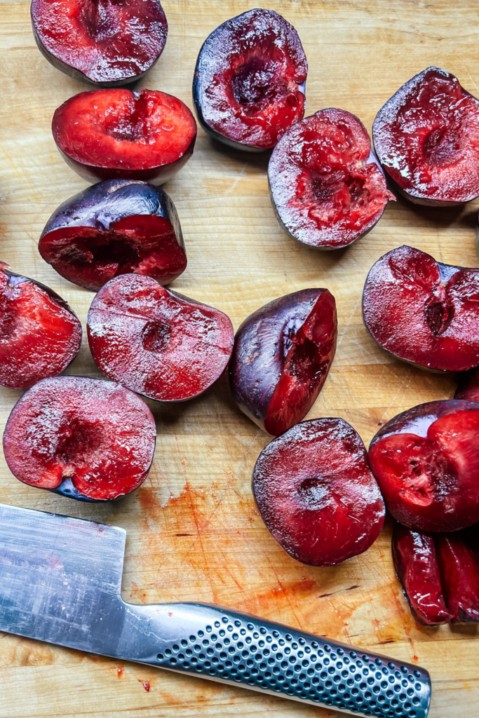 ripe plums halved and pitted