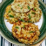 potato pancakes on a green, gold, and white plate