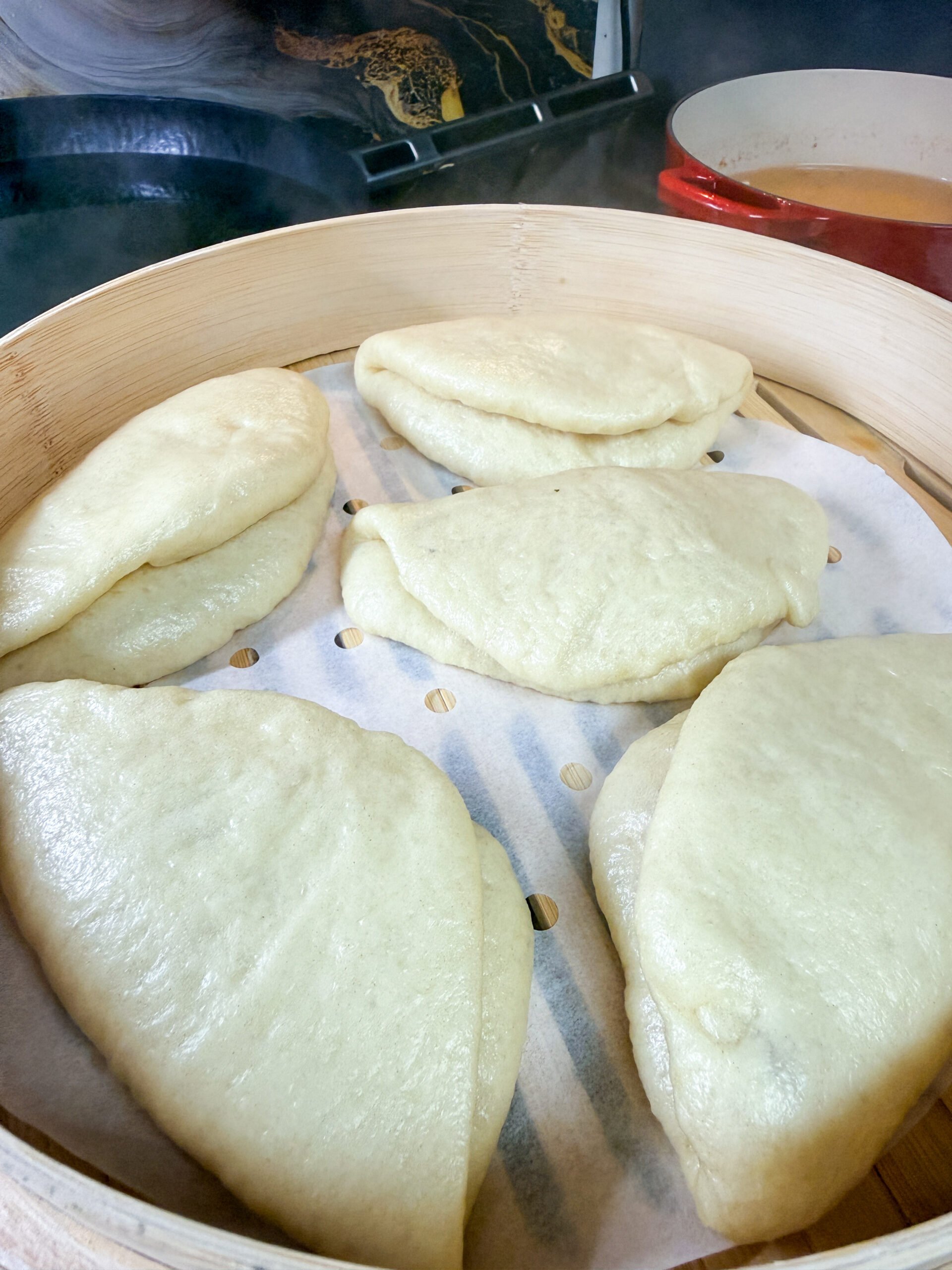 close-up of freshly steamed bao buns showing soft fluffy texture