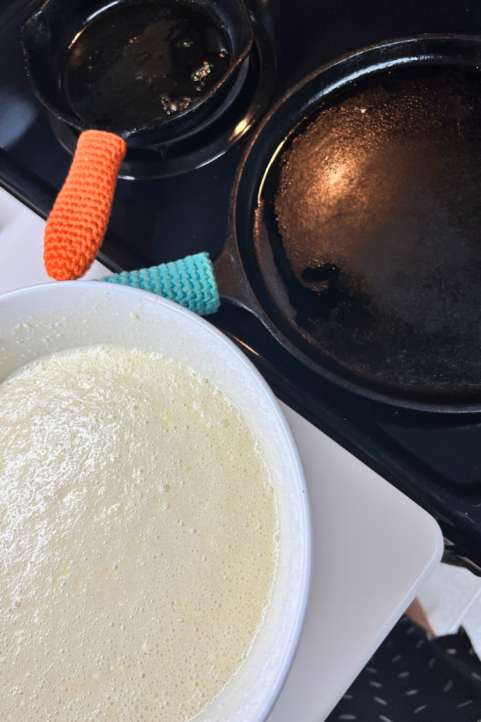 a bowl of batter sitting on top of a stove