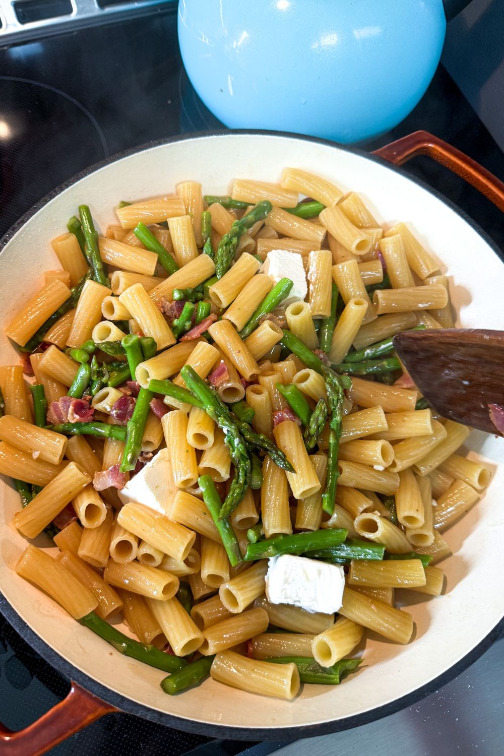 Cream cheese added to pasta to create creamy sauce