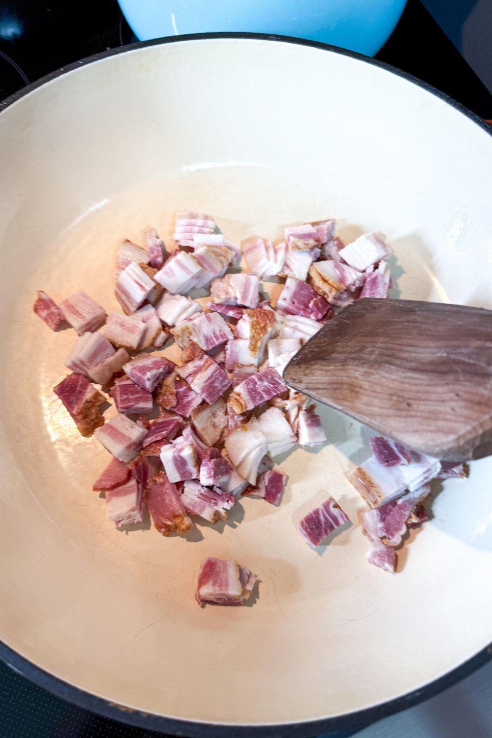 Cooking chopped bacon in a pot for one pot pasta recipe