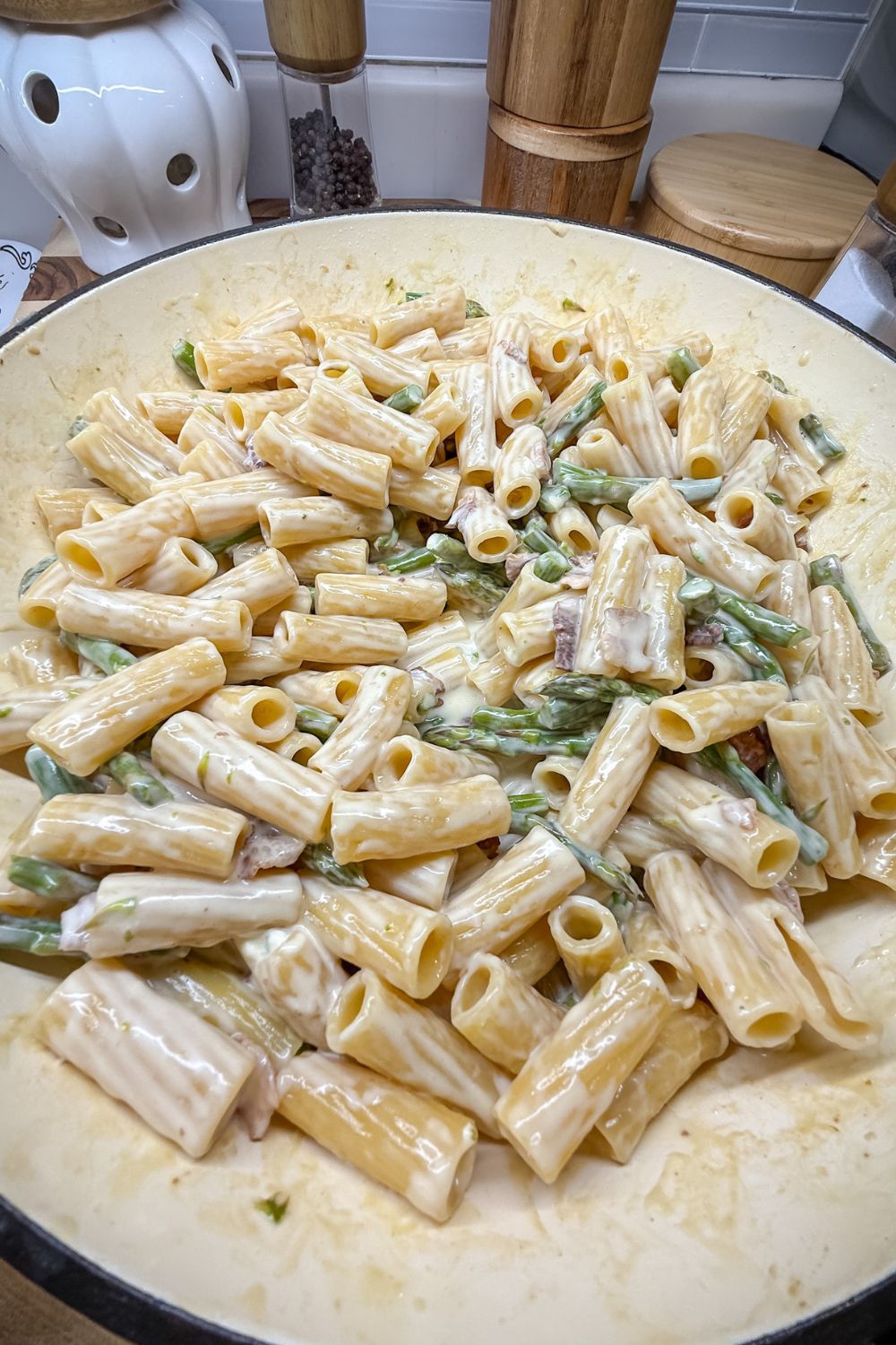 Cream cheese melted into pasta creating creamy sauce