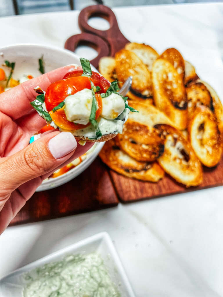 Finished salad crostini being held.