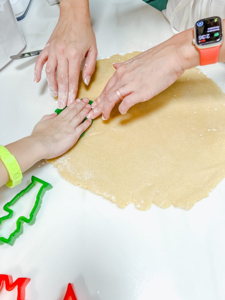 Helping one of my girls with a plastic cookie cutter