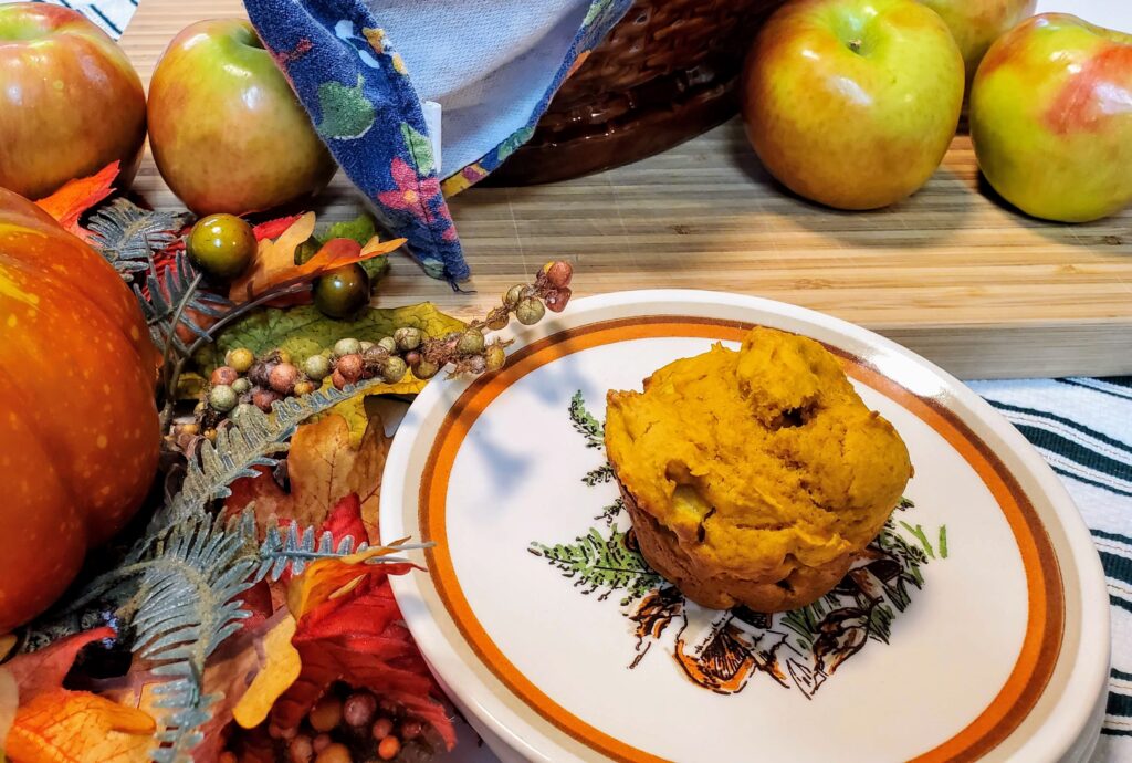 apple pumpkin muffin on a mushroom ceramic plate.