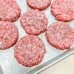 burger patties finished on a pan ready to be cooked