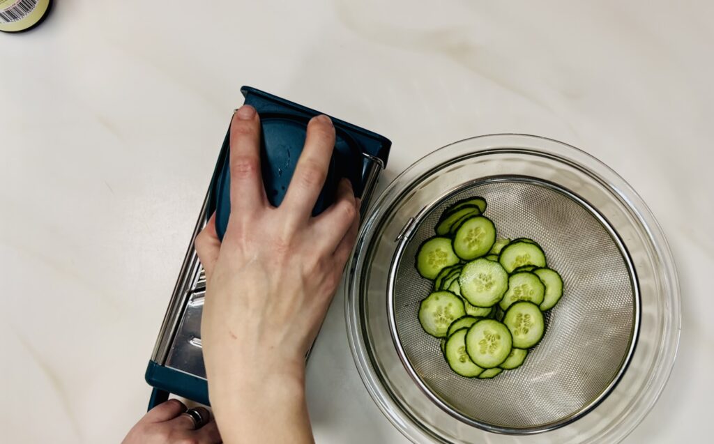 Using the Hand Guard with the slicer side of the box grater.