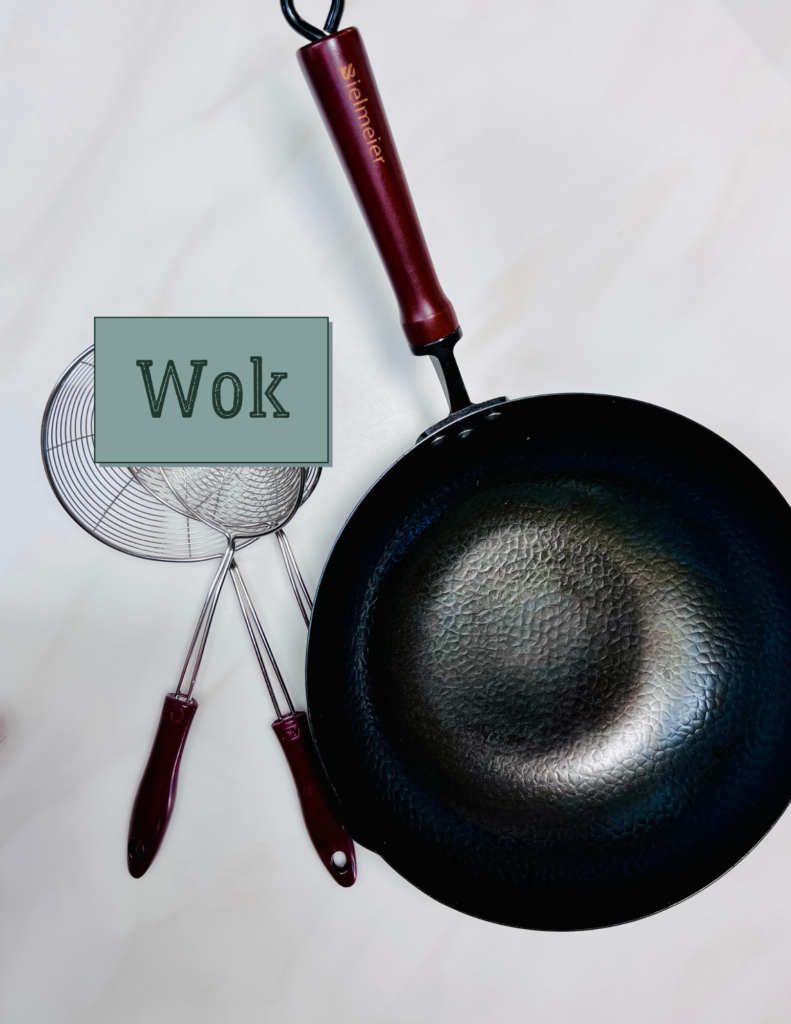 Click the image to buy your wok Image of a Wok with 3 different size spider strainers.
