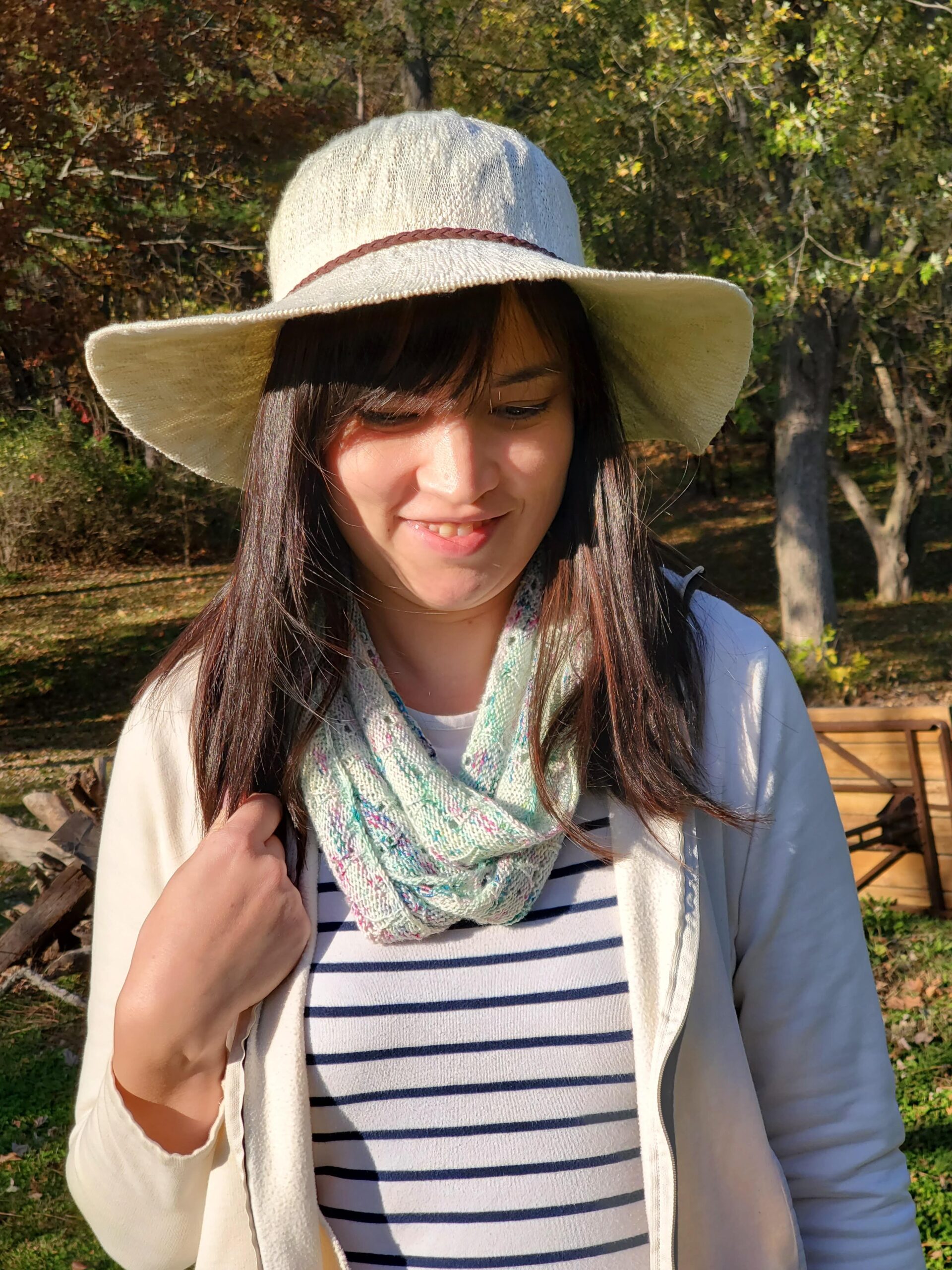 Creator (Jenn Smith - dark hair woman) wearing scarf.