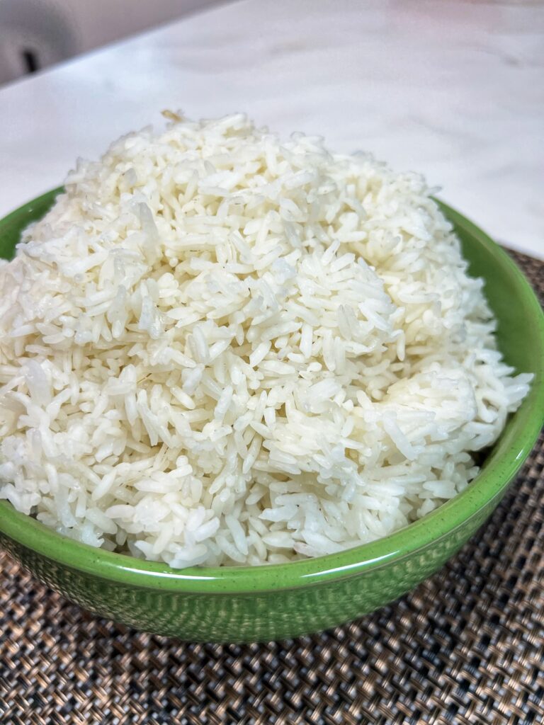 perfectly cooked rice in a nice ceramic green bowl.