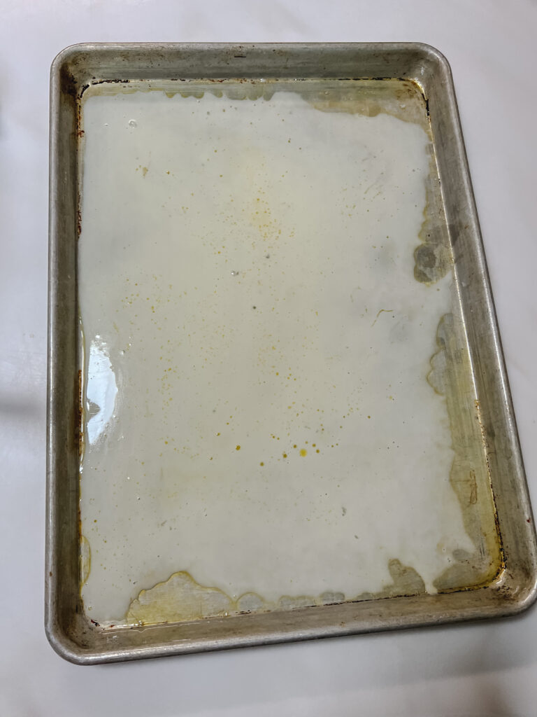 thin layer of batter on pan.