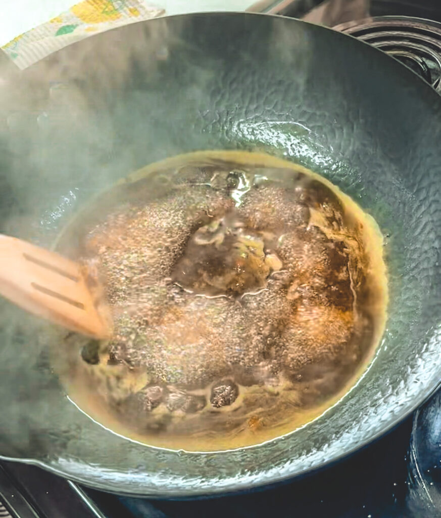 Sauce bubbling and thickening.