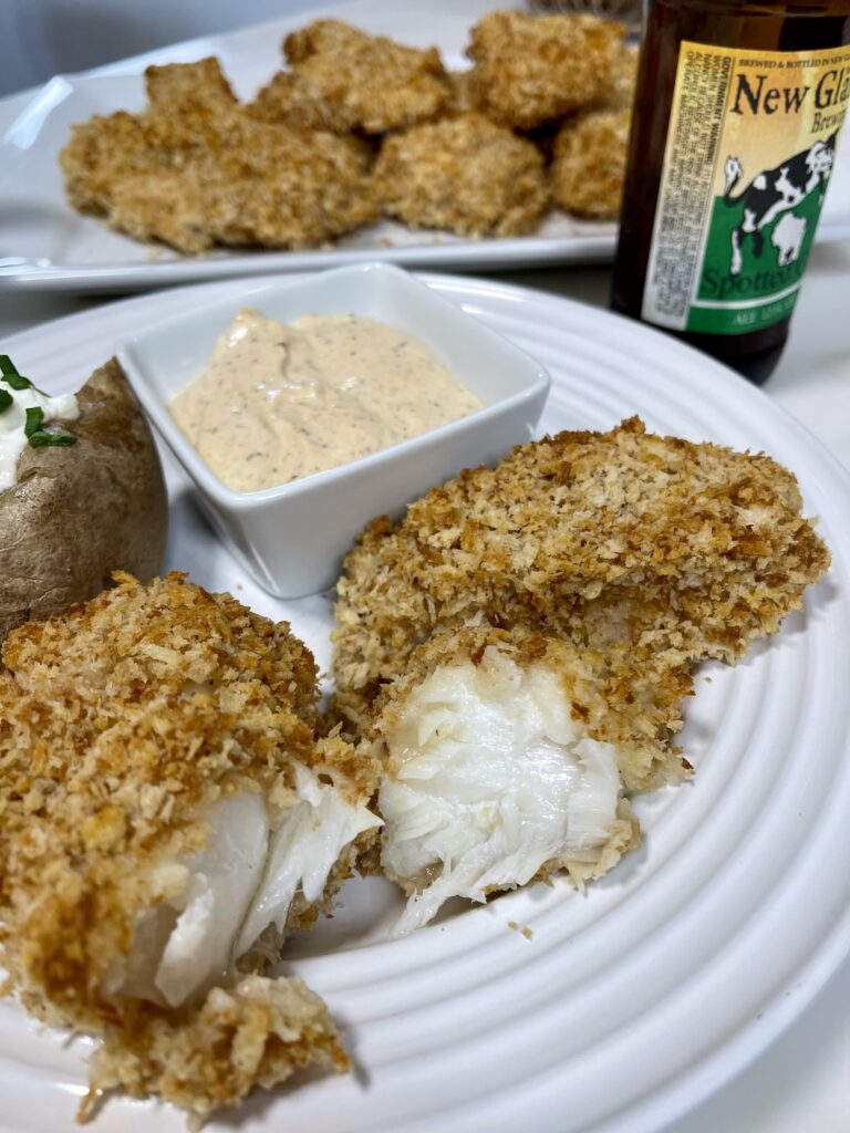 Oven baked beer batter fish cut in half.