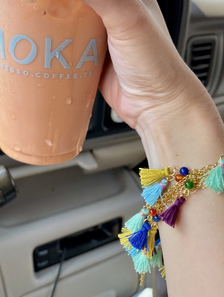 This picture of me wearing the necklace and holding (my absolute favorite coffee) is from instagram stories.