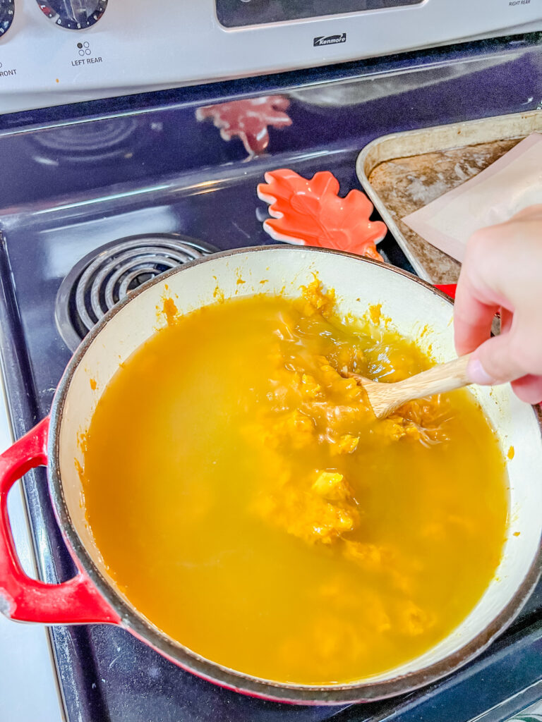 Stirring the broth into the soup