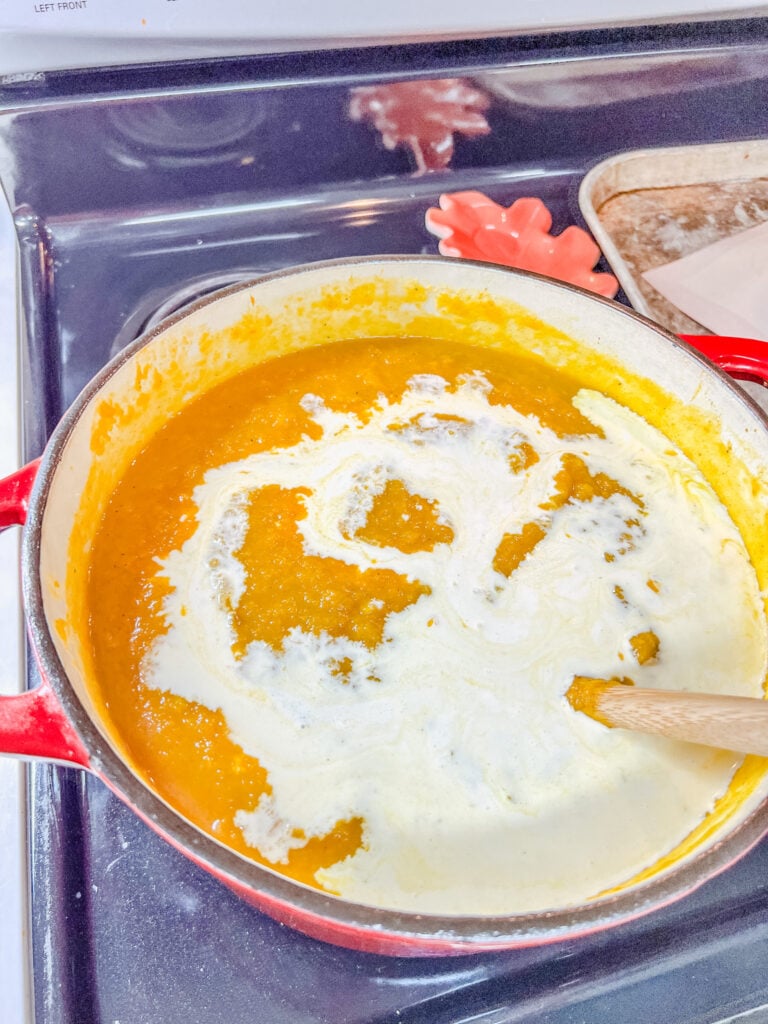 Adding the cream to the soup
