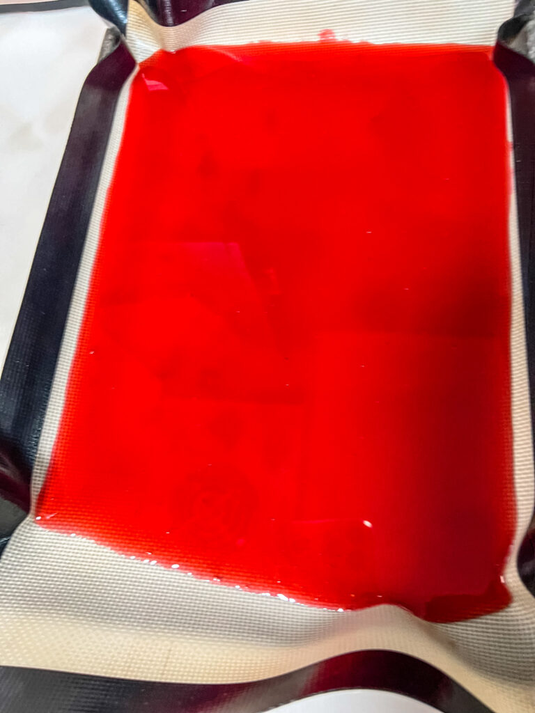 the cranberry sweet juice before freezing in a rimmed baking sheet lined with a heat proof silicon matte