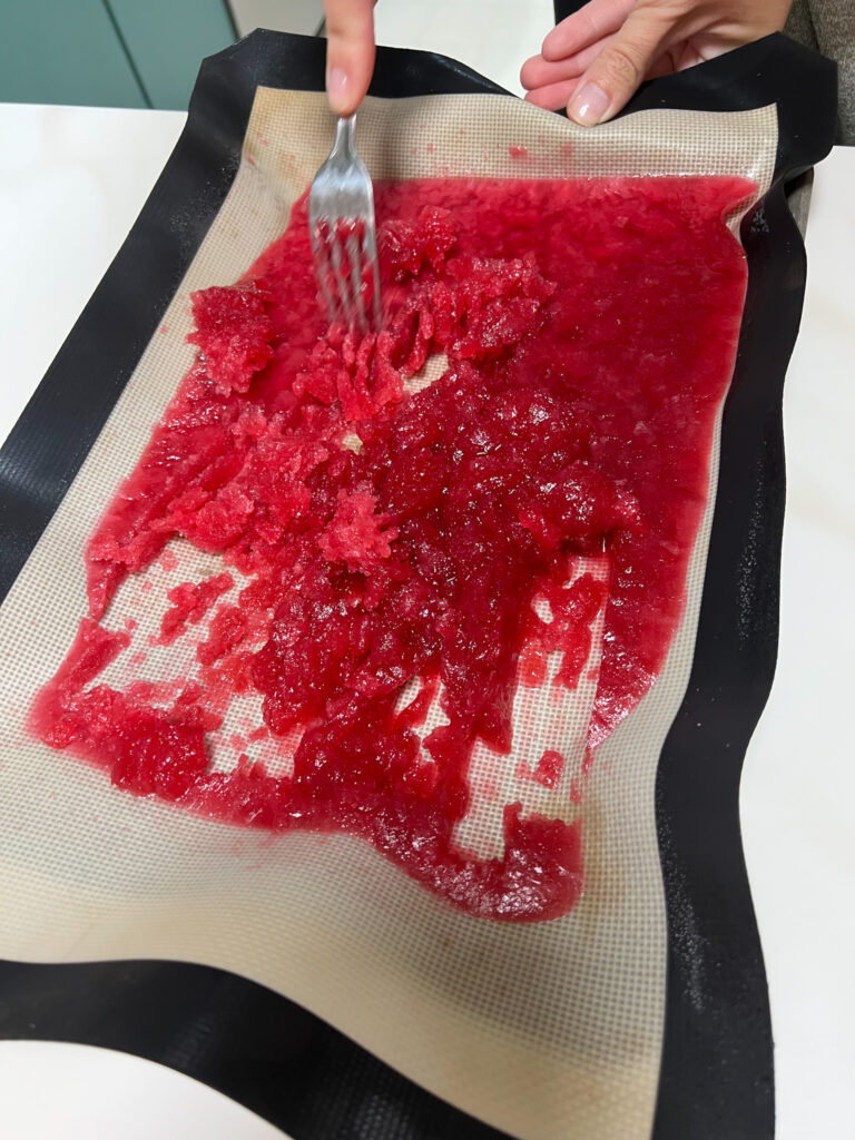 a forking breaking apart the now frozen granita.