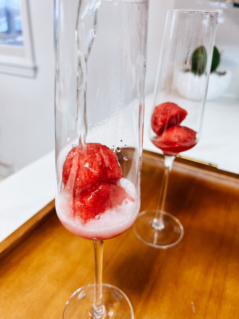 pouring the Prosecco over the granita.