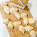 My completed Pain d'épi on a bamboo cutting board with butter.