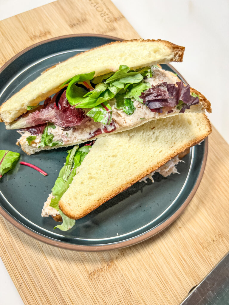Header image. Finished sandwich on a mora ceramics plate and bamboo cutting board.