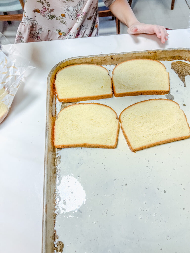 bread being placed onto the pan