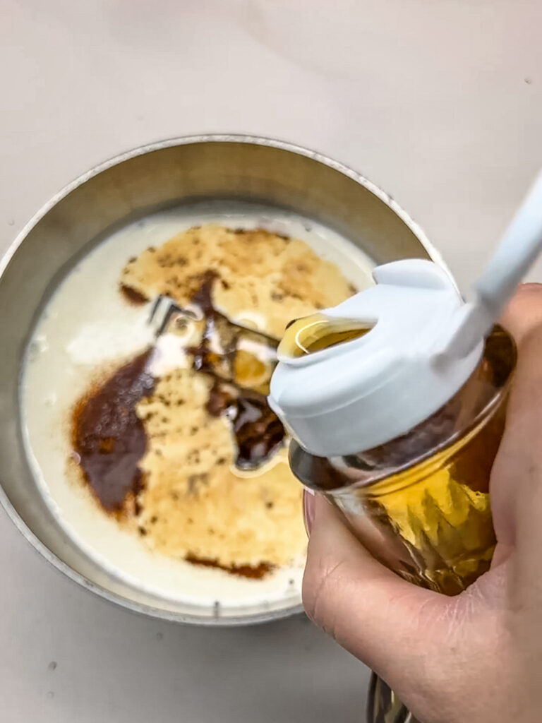 maple syrup being added to the pot
