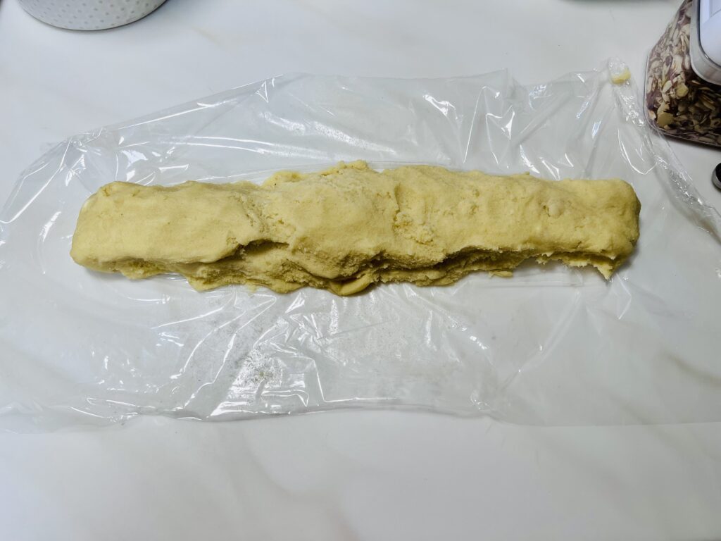 Chinese almond cookie dough on cling wrap.