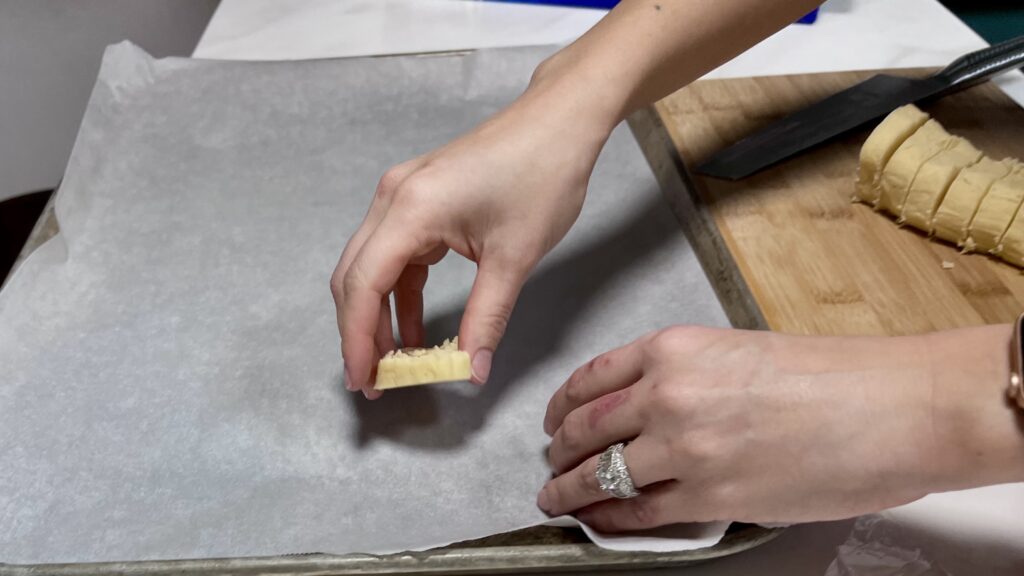 Placing Cookie Discs on pan.