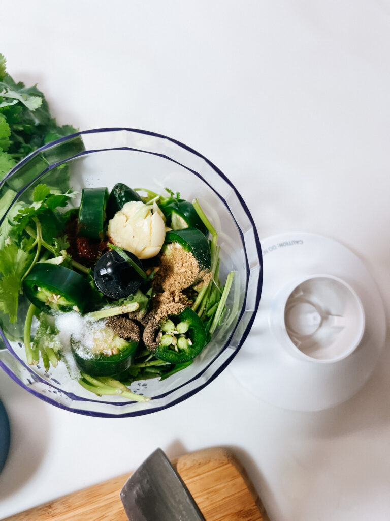 all ingredients other than the oil in the blender bowl.