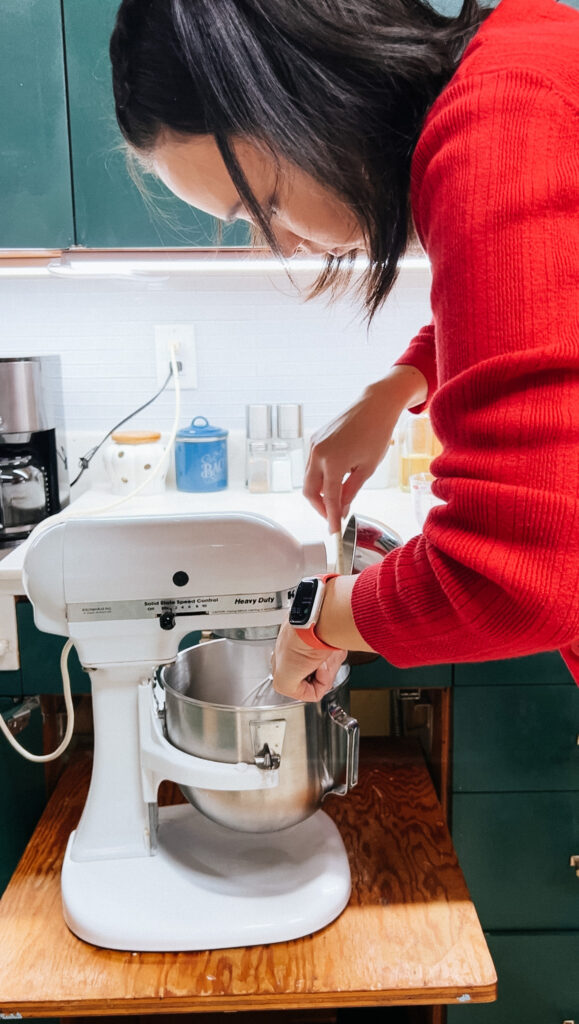 me adding the strawberry sugar syrup to the gelatin.