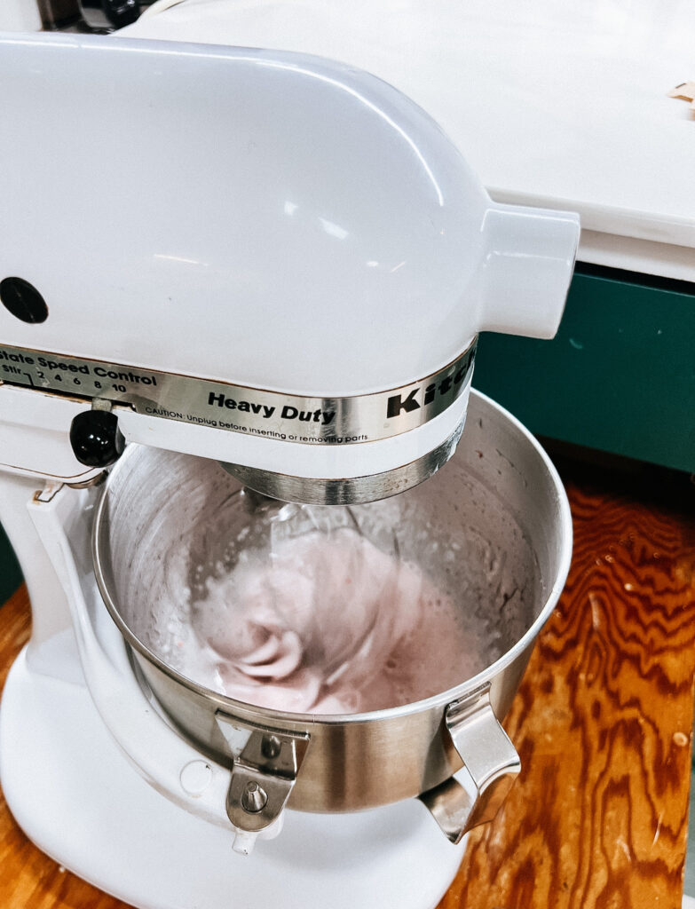 Strawberry syrup and gelatin mixing. the color is light pink.
