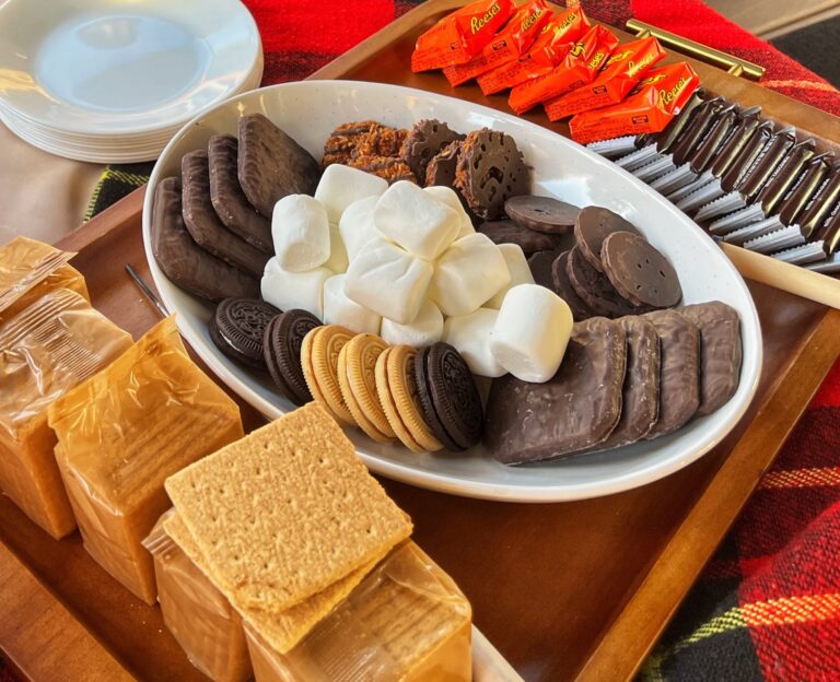 S'mores platter with graham crackers, marshmallows, cookies, and chocolate candies.