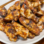 Finished Chicken Wings piled in a ceramic platter