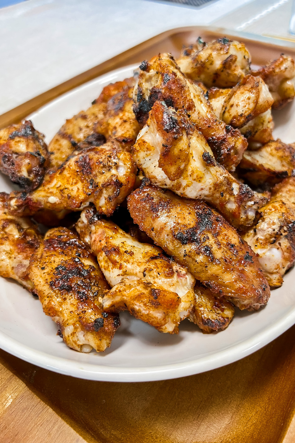 Finished Chicken Wings piled in a ceramic platter