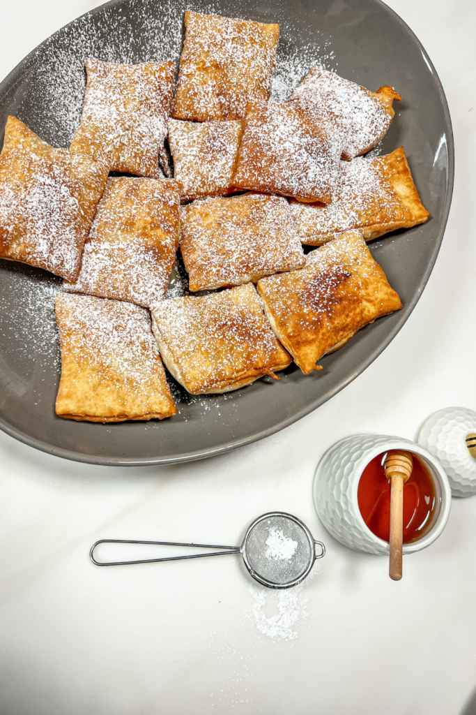 finished beignets with honey