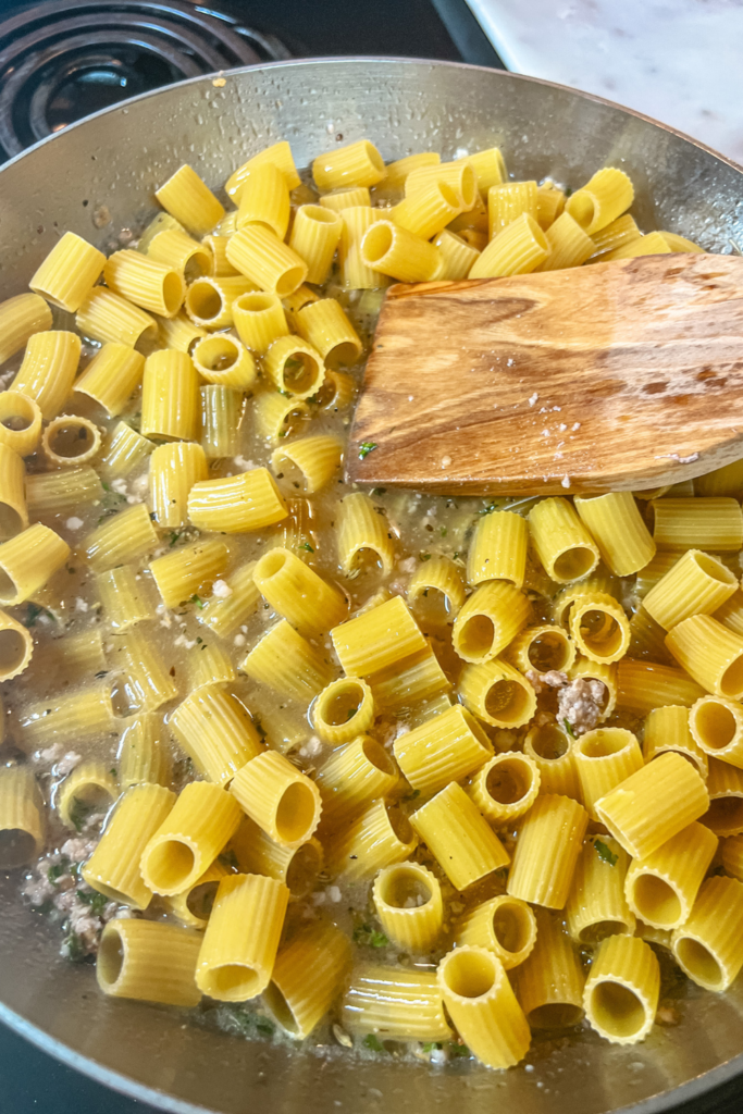 One-Pot Rigatoni Ragu - covering pasta with broth and meat micture