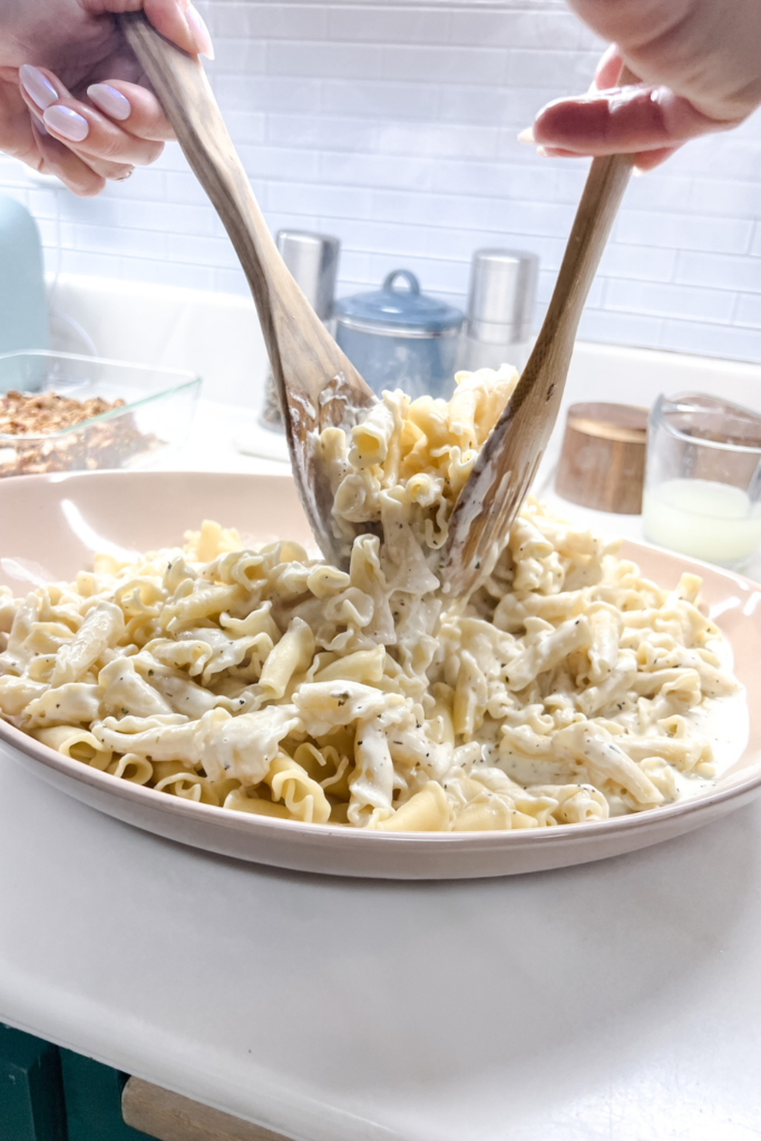 Tossing Pasta in Alfredo Sauce 2