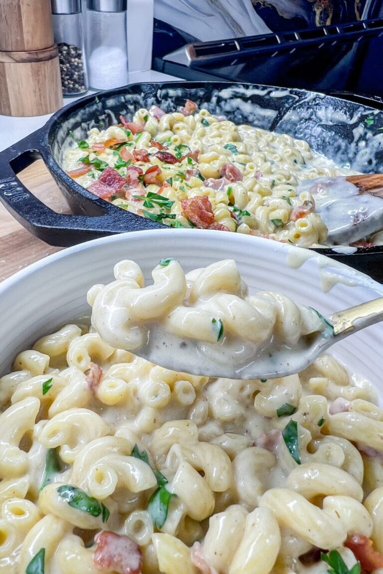 a bowl of macaroni and cheese with a spoon in it