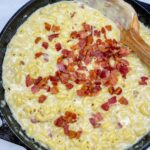 a skillet filled with Smoked Gouda and Bacon Mac and Cheese