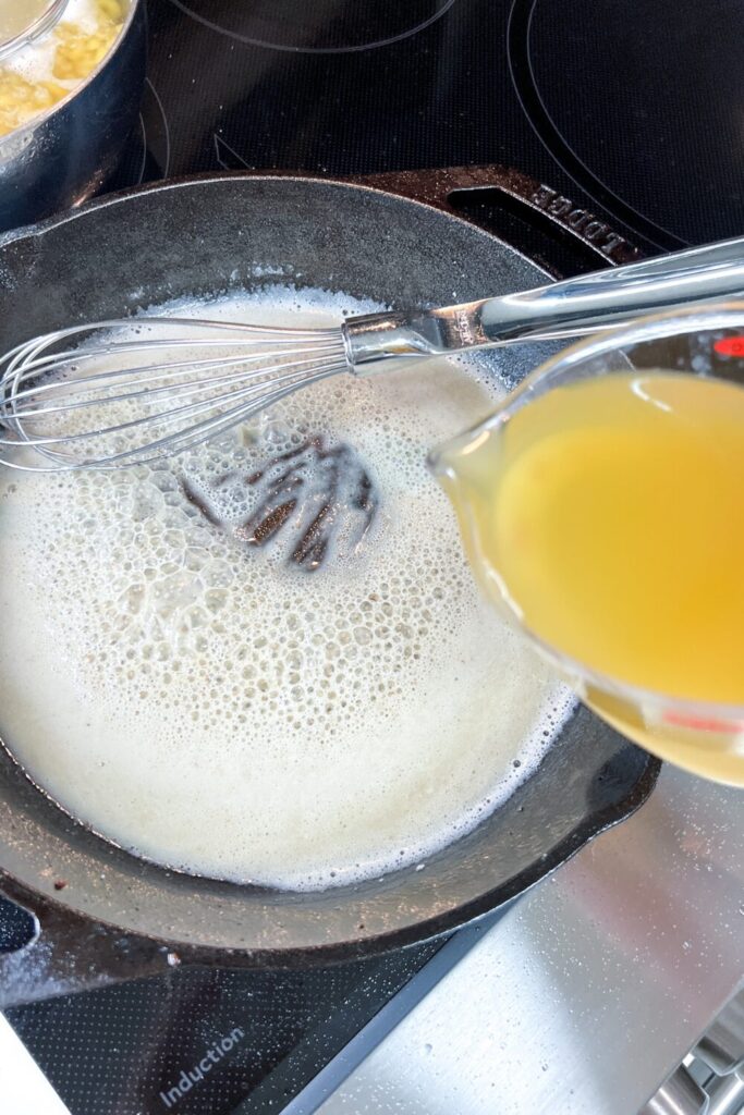 adding broth the flour mixture