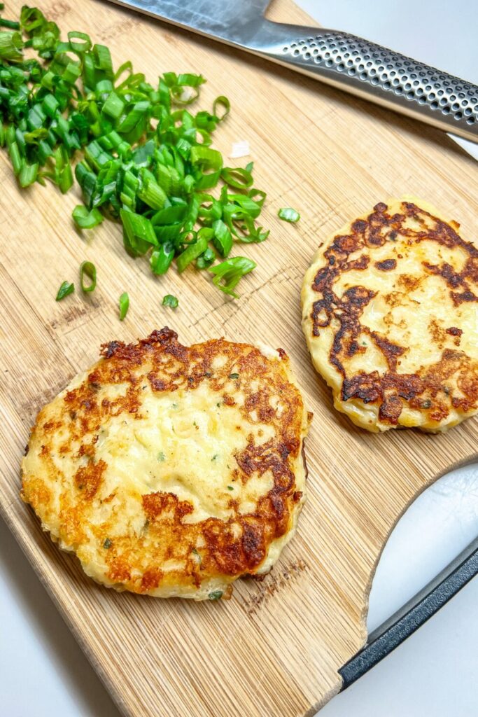 Mashed potato pancakes on a cutting board