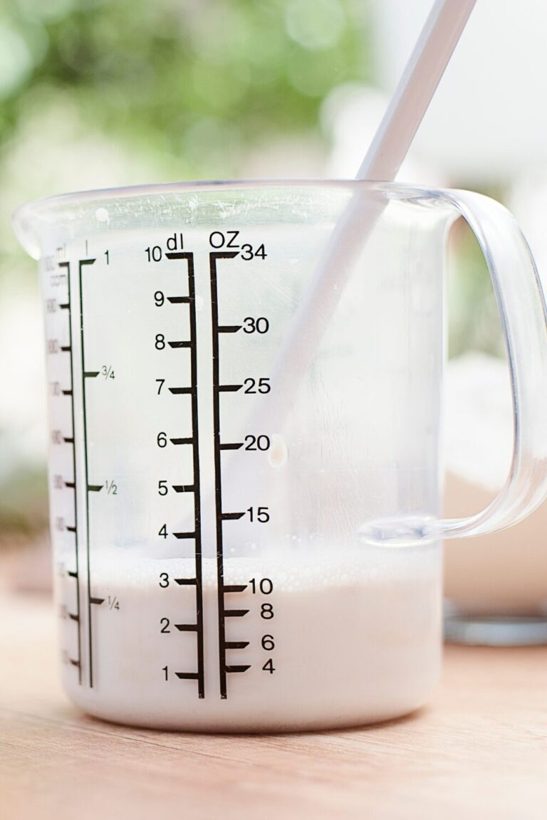 Whole milk in measuring cup
