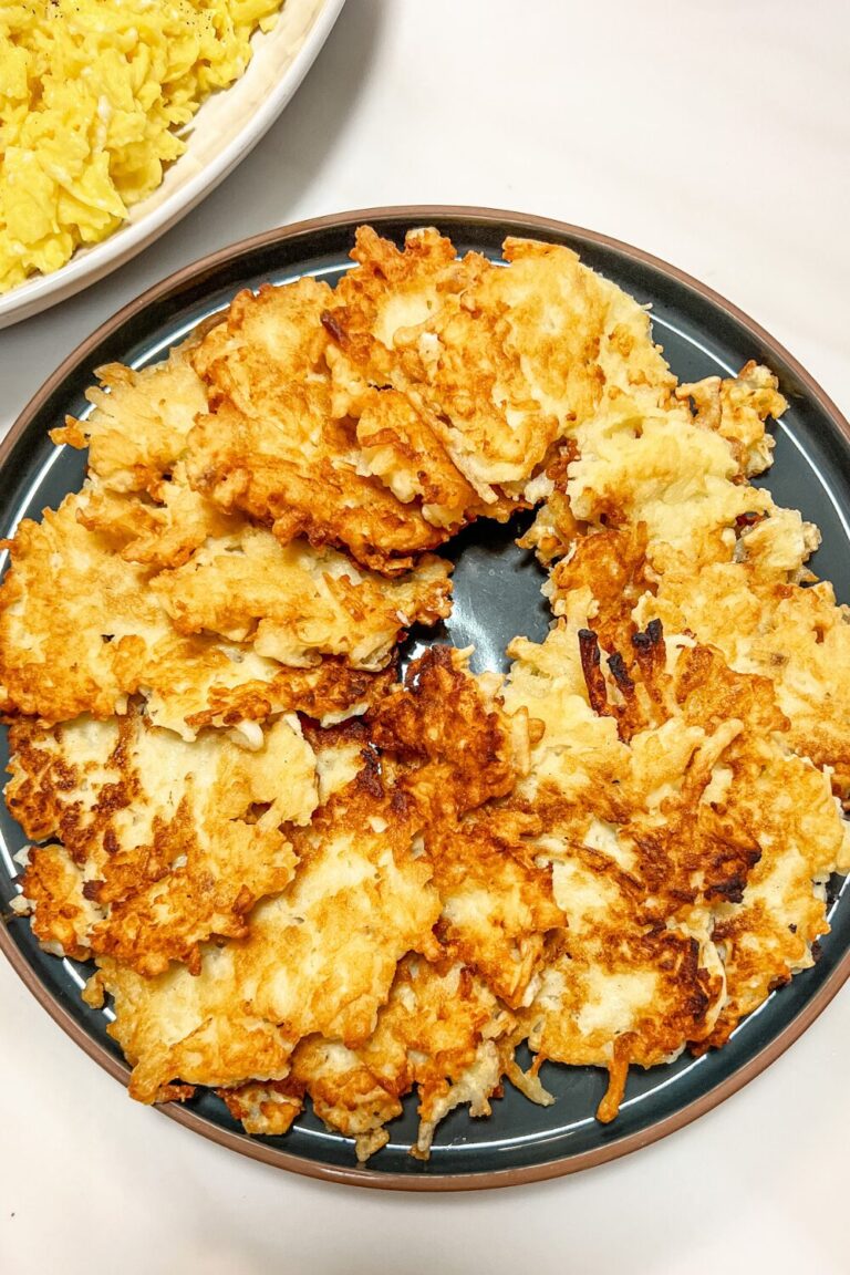 a plate topped with fried crispy potato pancakes