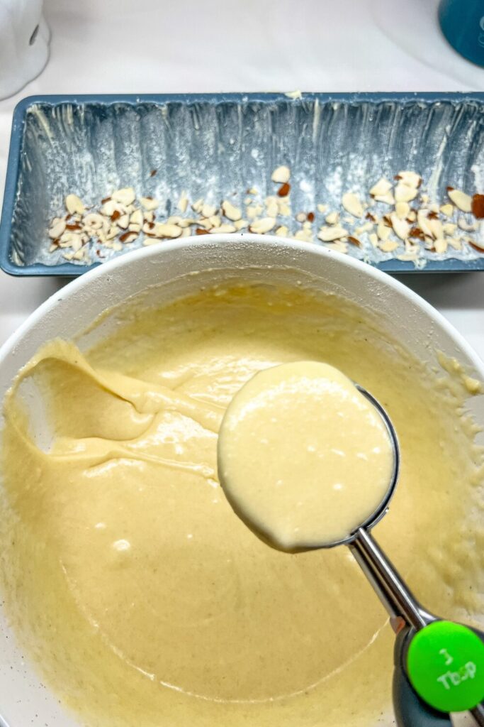 a cookie scoop filled with batter