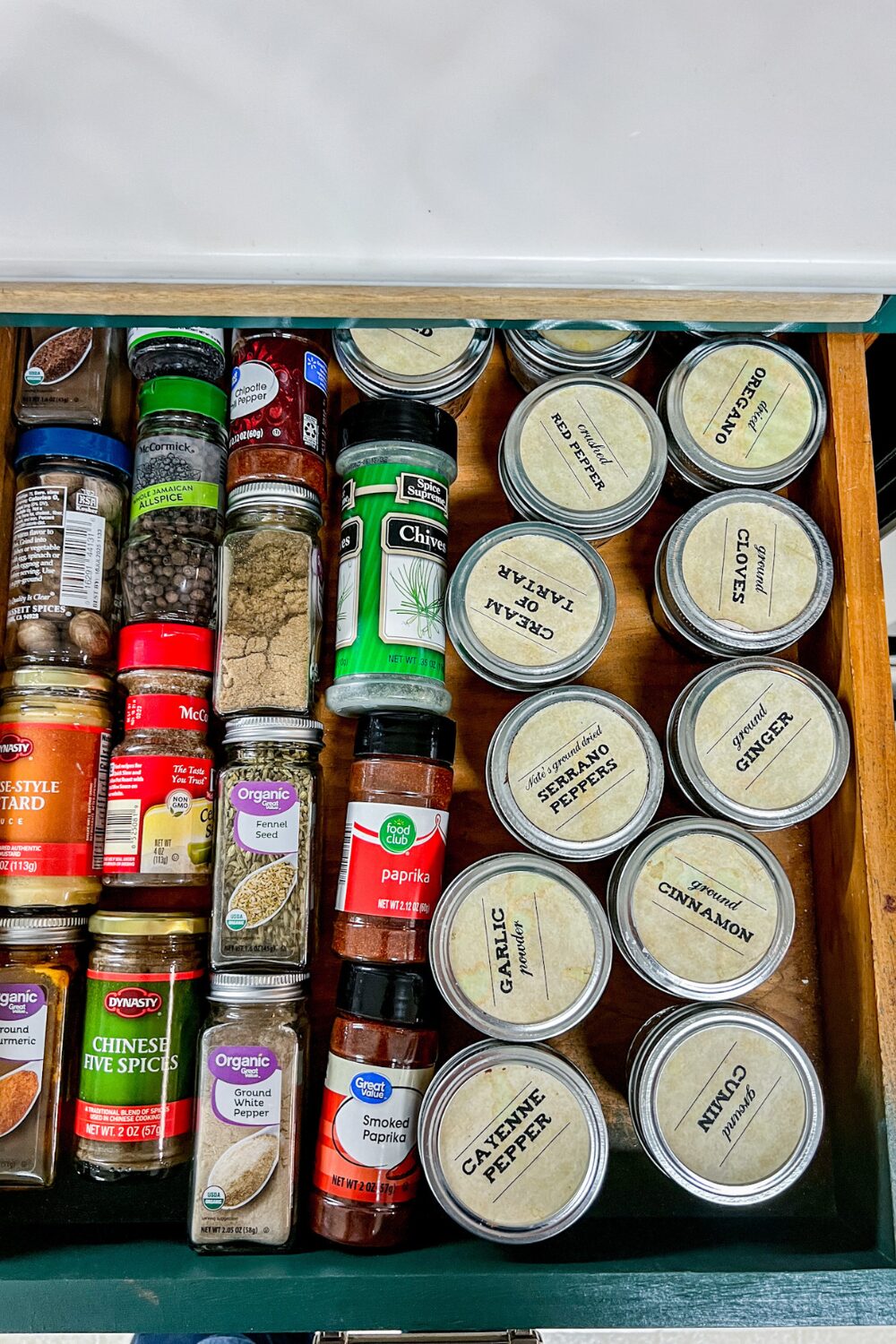 Before_ a drawer filled with jars of spices and spices