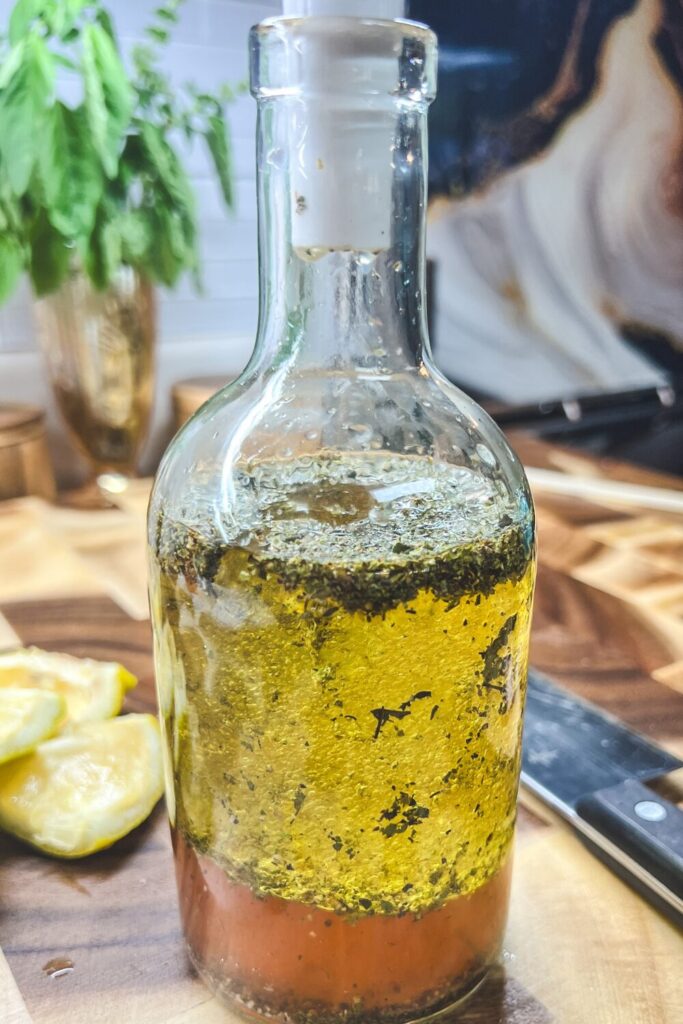 Greek Salad Vinaigrette ingredients in a bottle